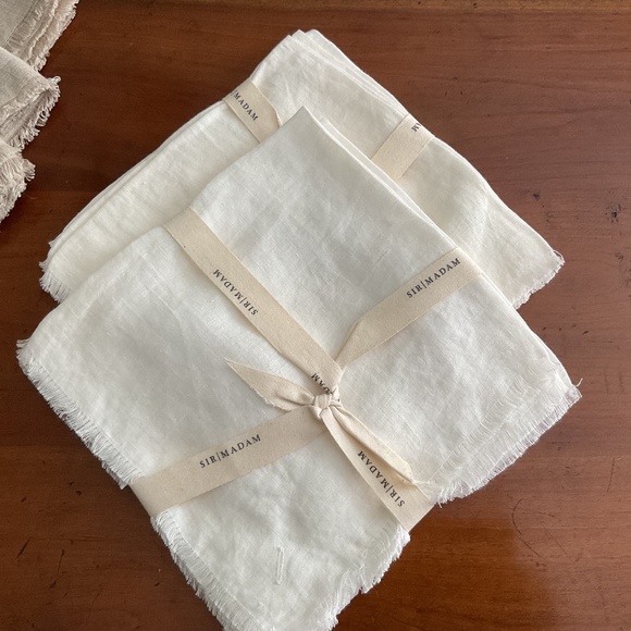 Set of four cream colored napkins